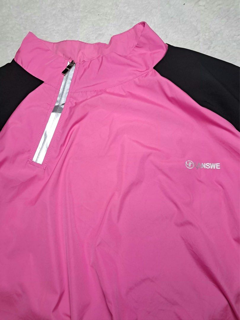 ANSWE Pink and Black Half Zip Jacket (Category: Coats, Jackets and Outerwear) located in Baguio. Submitted by padisellsz (Listing ID 1470645611, Image 3). Description: - Brand/Model: ANSWE half zip jacket - Very good condition - No issues - Colorway: Pink and black - Design: Short sleeves with mock neck collar - Warmth: Silver inner lining for heat retention - Fit: Elastic hem at bottom for a secure fit - Size: Approximately 21 x 24.5 inches.