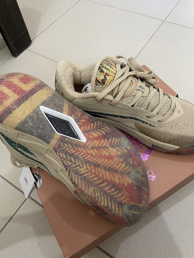 ANTA Kai 3 “Mastery” (Category: Sneakers) located in Manila. Submitted by sellwithbelly (Listing ID 1470594159, Image 3). Description: - Brand: Anta Kyrie Irving Kai 1 - Colorway: Tan / Multi-color - Condition: Brand new with original tags and matching box - Upper: Textured mesh with embroidered lightning bolt branding - Outsole: Colorful patterned translucent outsole with visible carbon fiber shank plate - Details: Special graphic tongue tags an