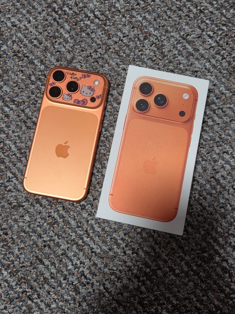 Apple iPhone17pro 256gb (Category: iPhone 17 Series) located in Manila. Submitted by thebestre (Listing ID 1470569347, Image 3). Description: - Color/Design: Vibrant orange with a cute Kitty sticker decal on the triple camera bump - Battery Health: Excellent at 97% with only 242 cycle counts - History: First used in December 2025 - Inclusions: Comes complete with the original box packaging - Condition: Well-maintained and ready to use.