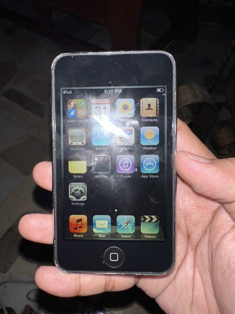 Apple iPod 16GB (Category: Portable Music Players) located in Quezon City. Submitted by tyne02 (Listing ID 1470600531, Image 2). Description: - Apple iPod with 16GB storage capacity - Classic black front and iconic polished chrome back - Fully working screen, touchscreen, and home button - Battery holds a charge for portable music - Standard apps like YouTube, Safari, and Settings included - Note: Has lots of surface scratches on the back casing 
