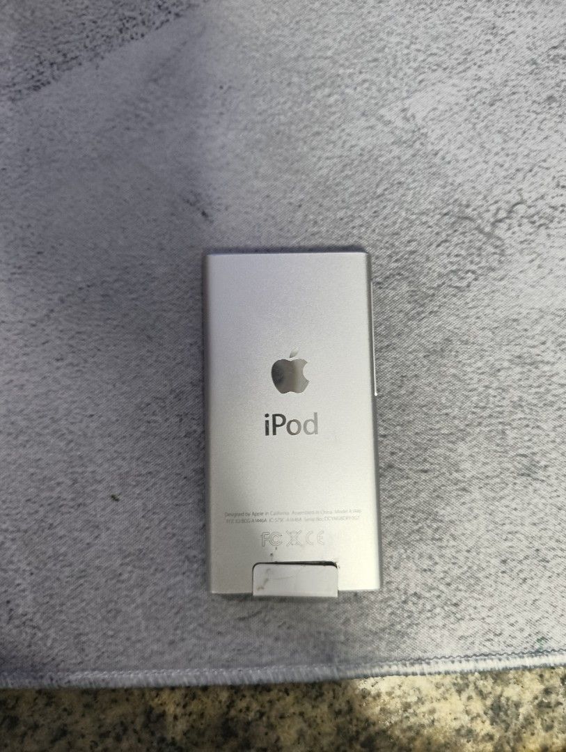 Apple iPod Nano 7th Generation Silver (Category: Portable Music Players) located in Manila. Submitted by turtleturt90052 (Listing ID 1470657409, Image 2). Description: Selling my Ipod 7th gen battery was replaced a few years ago so no battery problems -------------------------------------- HONEST KNOWN ISSUES Back part covering the bluetooth receptor is not sticking to it anymore (Slide 8) Part covering the screen is sticking out (Slide 6) Often 