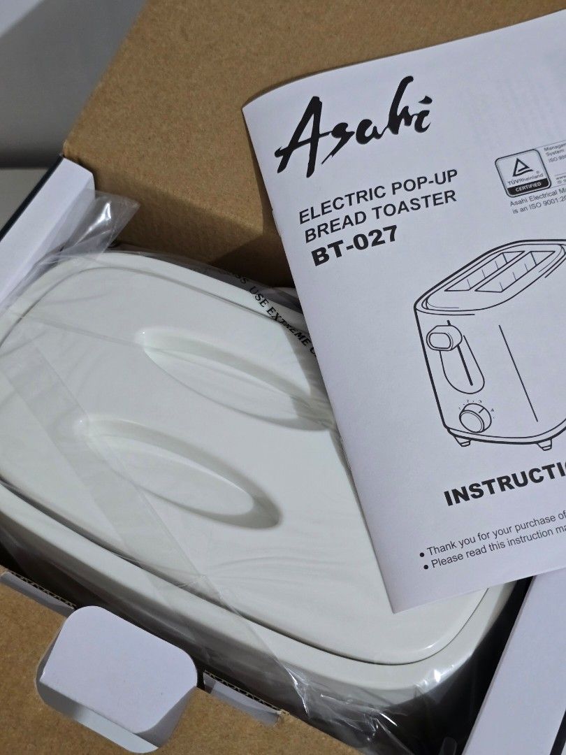 Asahi Pop-up Bread Toaster BT-027 White (Category: Ovens & Toasters) located in Muntinlupa City. Submitted by cinnapom (Listing ID 1470607375, Image 2). Description: - unused, opened only for inspection and photos - includes original box and instruction manual - original price is ₱900 - for delivery only via J&T/Grab/Lalamove (from Muntinlupa City).
