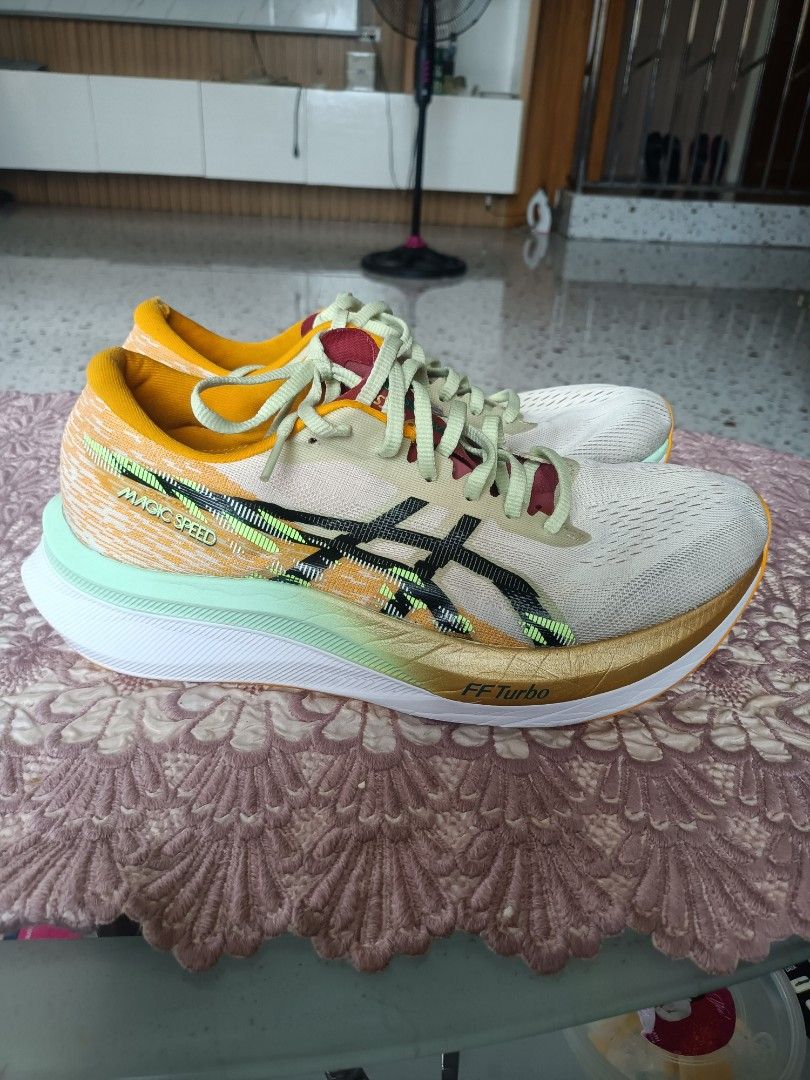 Asics Magic Speed running shoes (Category: Sneakers) located in Zamboanga. Submitted by caps_luck (Listing ID 1470569166, Image 2). Description: - Brand: Asics Magic Speed - Colorway: Vibrant multicolor with striking black branding, bright yellow collar, and mint green accents - Tech: FF Turbo cushioning and responsive carbon plate in the midsole - Upper: Breathable mesh - Condition: Worn a few times, uppers and soles still have plenty of life le