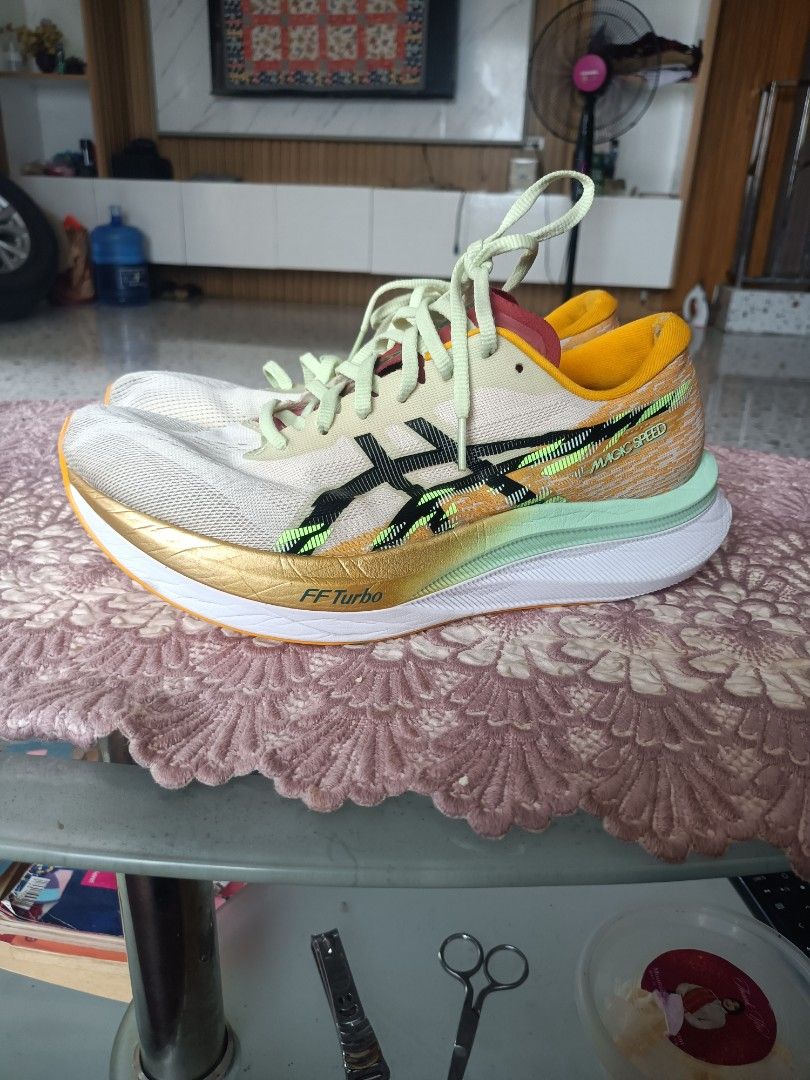 Asics Magic Speed running shoes (Category: Sneakers) located in Zamboanga. Submitted by caps_luck (Listing ID 1470569166, Image 1). Description: - Brand: Asics Magic Speed - Colorway: Vibrant multicolor with striking black branding, bright yellow collar, and mint green accents - Tech: FF Turbo cushioning and responsive carbon plate in the midsole - Upper: Breathable mesh - Condition: Worn a few times, uppers and soles still have plenty of life le