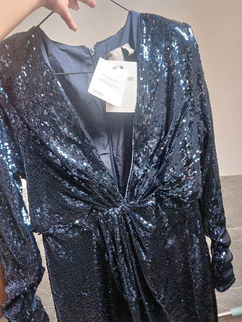 ASOS Navy Sequin Long Sleeve Dress (Category: Dresses) located in Marikina City. Submitted by laila15 (Listing ID 1470734119, Image 2). Description: - Condition: Brand new with original retail tags attached - Color: Navy blue with all-over sparkly sequins - Design: Long sleeves with a stylish twist knot front detail - Closure: Secure zipper closure in the back - Comfort: Fully lined inside for a smooth fit - Perfect for: Parties, weddings, holida