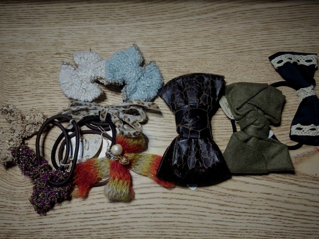 Assorted Bow Hair Ties Set (Category: Hair Accessories) located in Mogpog. Submitted by runfree_45 (Listing ID 1470742101, Image 1). Description: - Brand new with original Japan price tags (K's company: 500-1200 yen) - Bundle of gorgeous hair ties with various bow designs - Assorted premium textures: faux leather, suede, fuzzy yarn, and lace-trimmed - Colors include: black, olive green, brown, light blue, cream, and multi-color textured - Durable