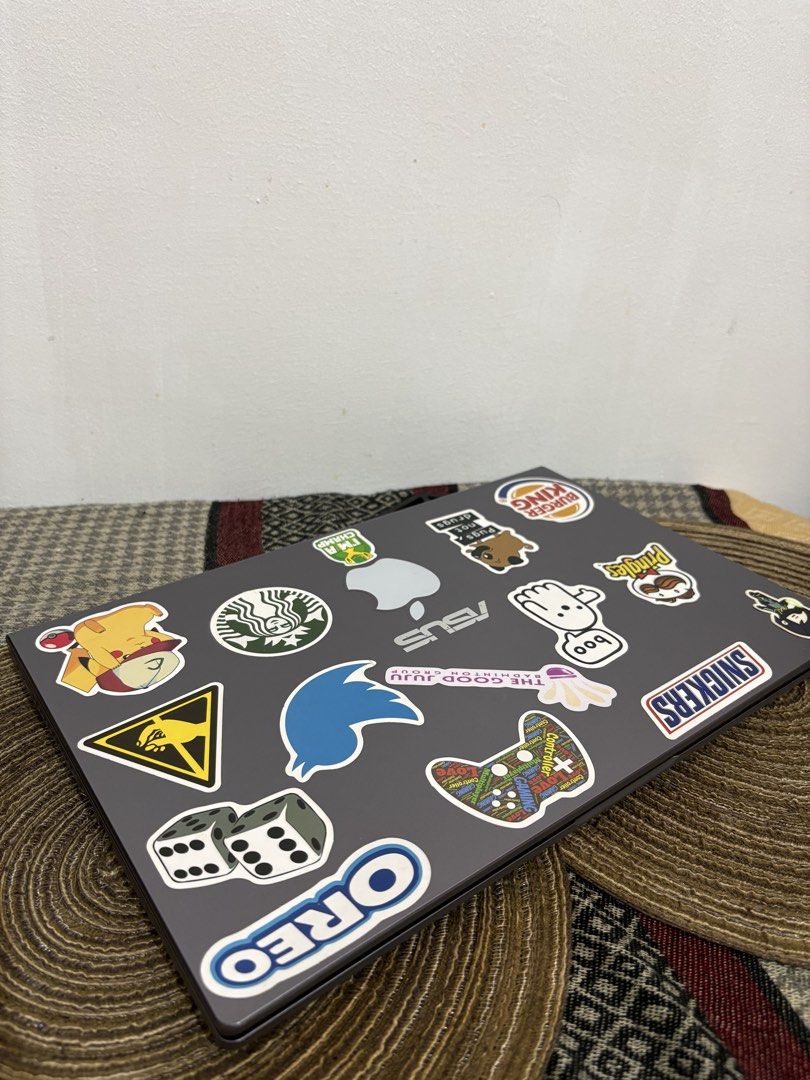 ASUS Laptop AMD Ryzen 3 Radeon Graphics (Category: Laptops & Notebooks) located in Makati City. Submitted by bryyyyyyyy16 (Listing ID 1470663731, Image 2). Description: - Brand/Model: ASUS Laptop (Gray chassis) - Processor: AMD Ryzen 3 - Graphics: AMD Radeon Graphics - Display: NanoEdge display - Keyboard: Backlit keyboard - OS: Windows - Customization: Lid is covered with various pop culture stickers; McDonald's logo sticker on the palm rest - C