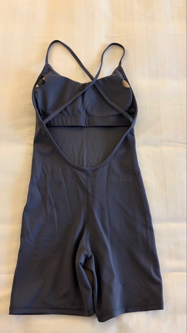 Athletic Yoga Romper Dark Grey Strappy Back (Category: Activewear) located in Manila. Submitted by letmeclean (Listing ID 1470668291, Image 1). Description: - Color: Dark Grey - Style: Workout romper with mid-thigh biker shorts - Support: Built-in bra with removable padding - Design: Scoop neckline and trendy crisscross thin back straps - Fabric: Soft, highly stretchy, and comfortable - Ideal for: Yoga, pilates, gym sessions, or casual wear - Con
