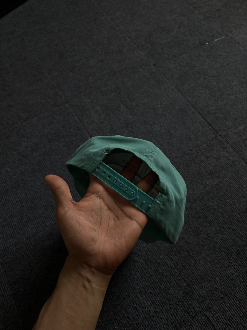 Austin Beerworks Green Snapback Hat (Category: Caps & Hats) located in Manila. Submitted by toys_hats005 (Listing ID 1470629154, Image 2). Description: - Brand: Austin Beerworks - Style: Green snapback cap with adjustable snap closure - Details: Woven front patch with red lettering, red and white twisted rope along the brim - Interior: Clean lining with white mesh structure inside front panels - Condition: Great overall condition.
