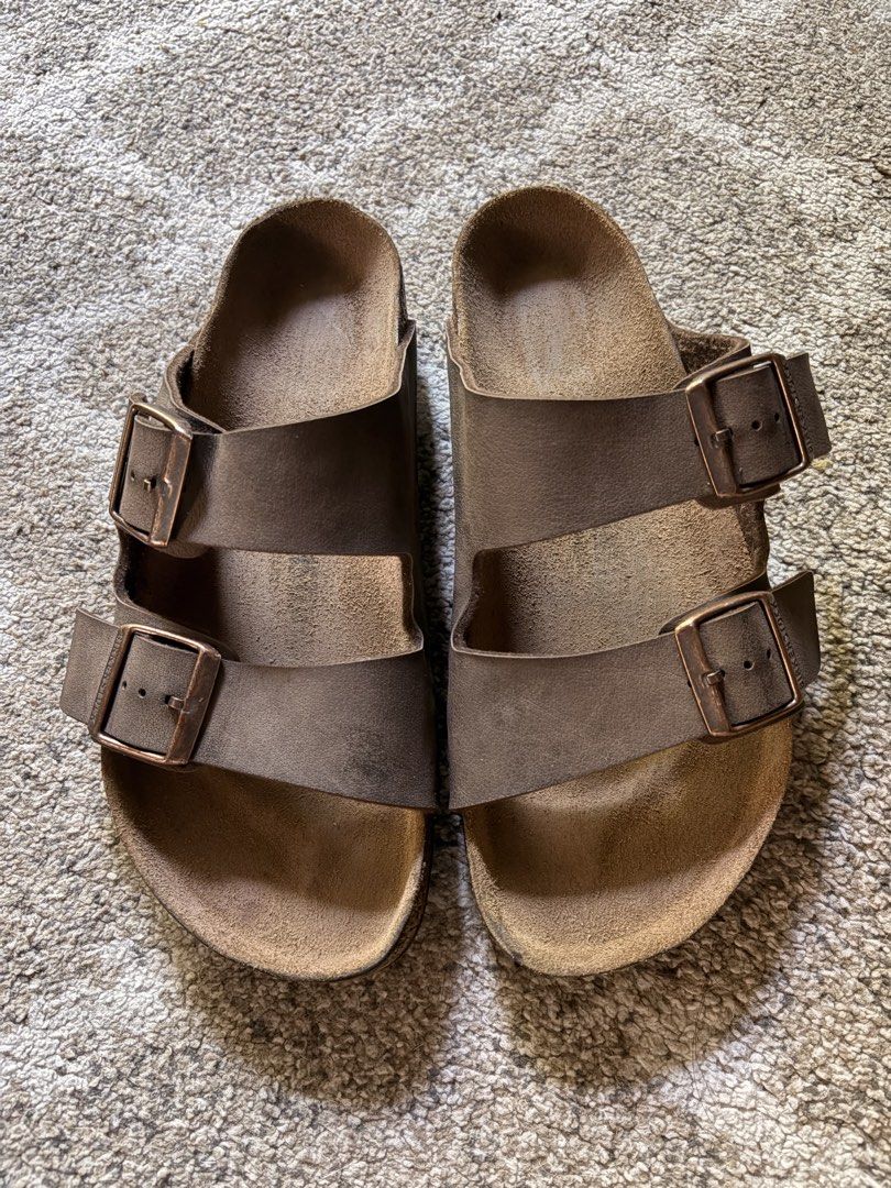 Auth Preloved Birkenstock Arizona Mocha (Category: Slippers and slides) located in Paranaque City. Submitted by silentstone.dolphin (Listing ID 1470654719, Image 1). Description: Color Mocha.. Brass Buckle.. Visible Print.. Size 38RF.. Best Seller Colorway!👌 All Time Favorite🥳 Super Nice in Actual😍.