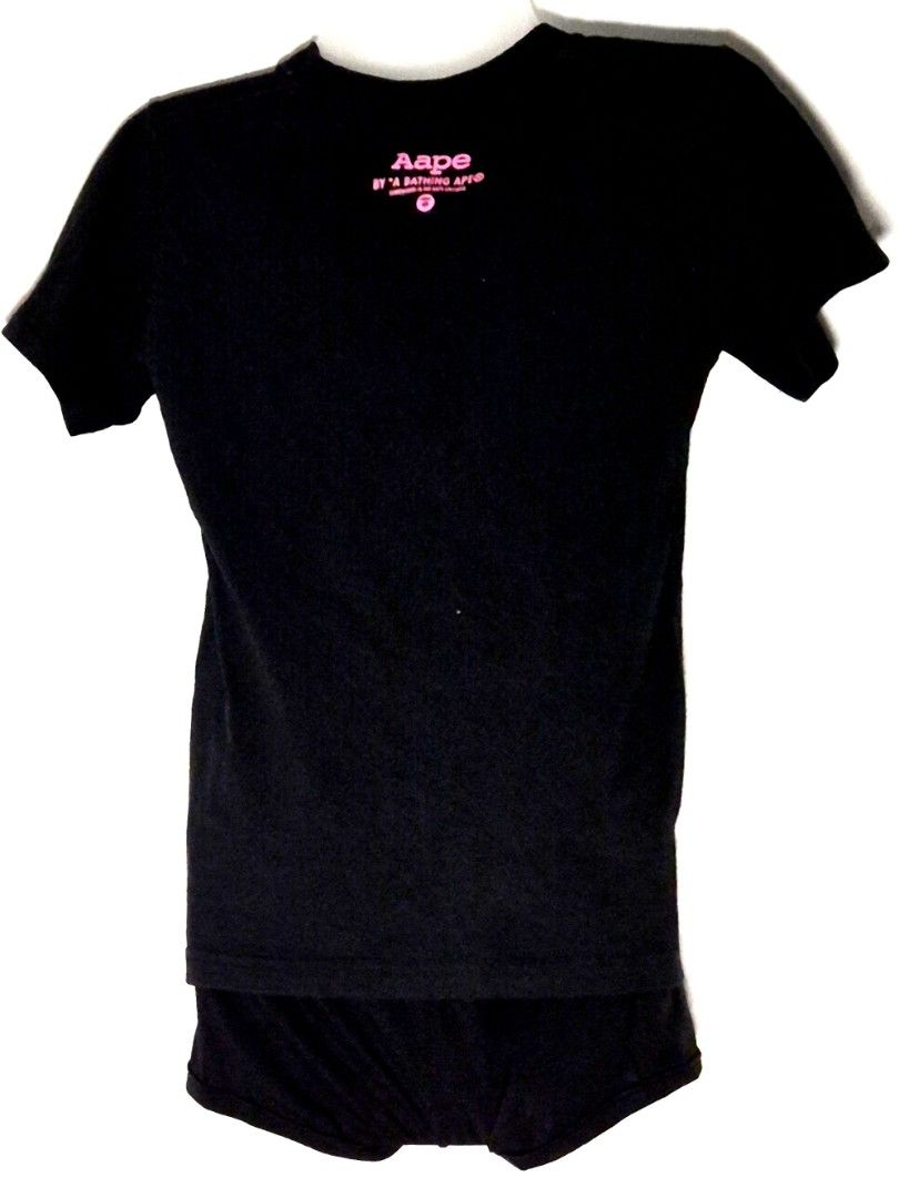 Authentic AAPE By A Bathing Ape "Moonface" Tee (Category: Shirts) located in Antipolo. Submitted by saribymonica (Listing ID 1470572996, Image 2). Description: Authentic AAPE By A Bathing Ape "Moonface" Tee Condition: Excellent preloved condition. The front pink graphic is flawless with no cracking or fading. Inner care tag has been cut, but all branding markers and security tags are perfectly intact (see photos). Authenticity: 100% Authentic. Fe