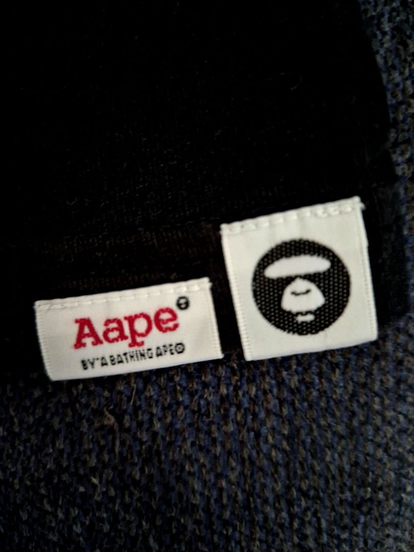Authentic AAPE By A Bathing Ape "Moonface" Tee (Category: Shirts) located in Antipolo. Submitted by saribymonica (Listing ID 1470572996, Image 3). Description: Authentic AAPE By A Bathing Ape "Moonface" Tee Condition: Excellent preloved condition. The front pink graphic is flawless with no cracking or fading. Inner care tag has been cut, but all branding markers and security tags are perfectly intact (see photos). Authenticity: 100% Authentic. Fe