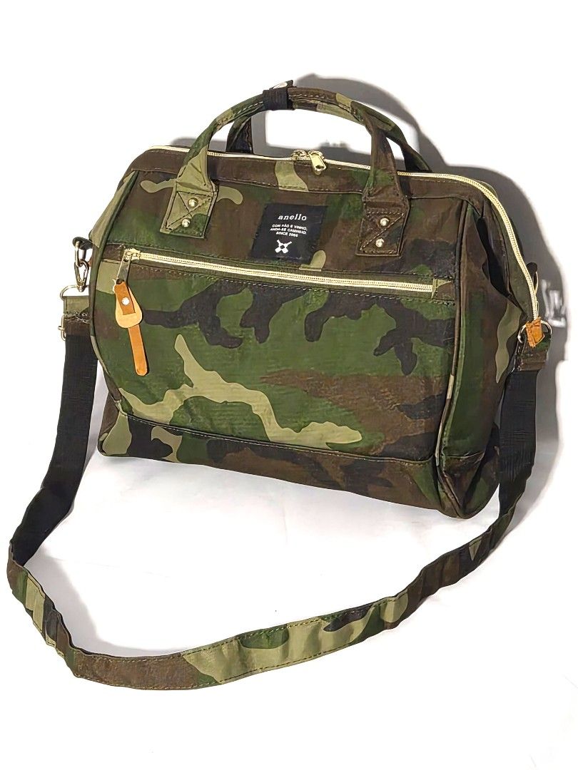 Authentic Anello 2-Way Boston Shoulder Bag (Camo) - (Category: Cross-body Bags) located in Antipolo. Submitted by saribymonica (Listing ID 1470560513, Image 2). Description: Authentic Anello 2-Way Boston Shoulder Bag (Camo) - Like New Condition: Like New (Used only twice) Description: Selling an authentic Anello 2-Way Boston Bag in a classic Camouflage print. This has only been used twice, so it is in immaculate, like-new condition. No fading, no