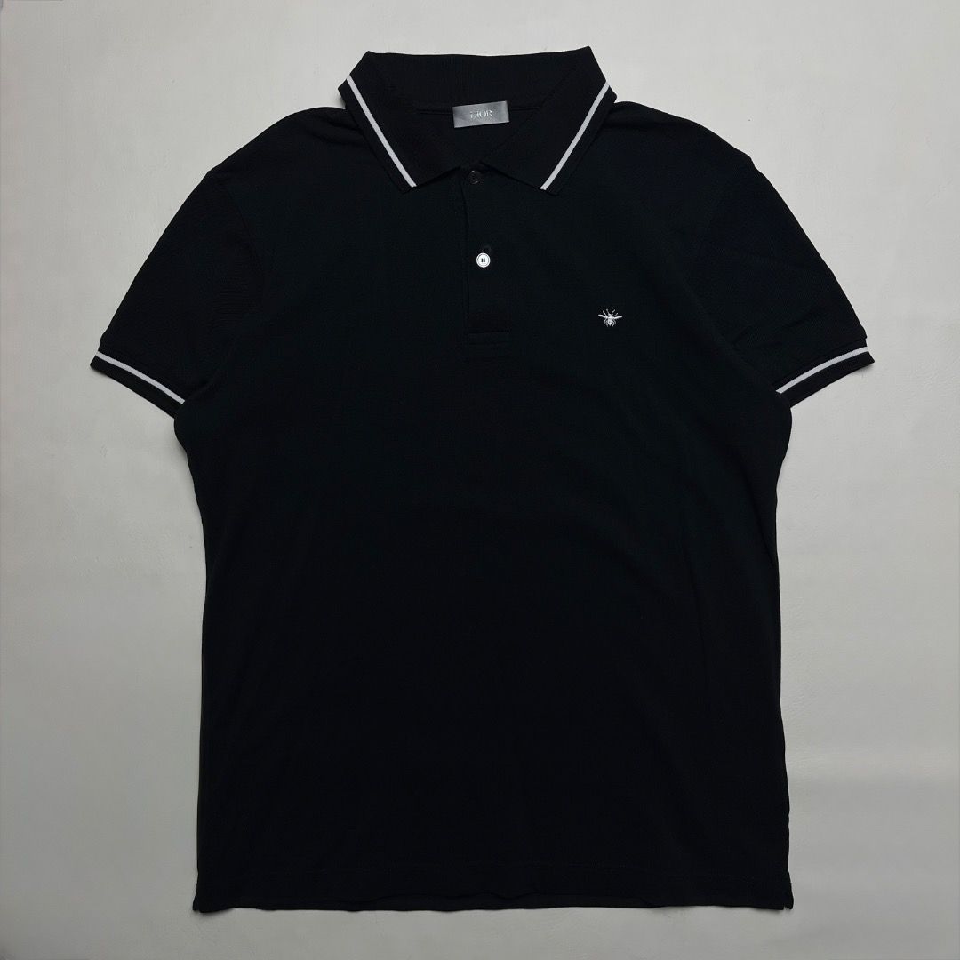 Authentic Dior Bee Embroidered Polo Shirt Black (Category: Tshirts & Polo Shirts ) located in Caloocan City. Submitted by achilles_grails (Listing ID 1470727876, Image 1). Description: - Brand: Dior - Item: Black knit polo shirt - Size: L - Material: 100% cotton (Made in Italy) - Details: Contrasting white stripes on collar and sleeves, iconic embroidered bee logo on chest, branded mother-of-pearl buttons - Condition: Clean and well-maintained - 