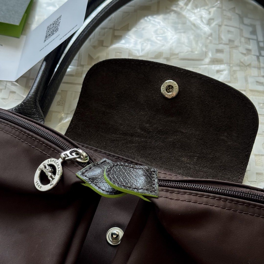 Authentic Longchamp Le Pliage Green Series Mocha Large Long Handle (Category: Shoulder Bags) located in Mandaluyong City. Submitted by theprimeclassics (Listing ID 1470666498, Image 3). Description: Personal preloved for SALE! Longchamp Le Pliage Green Series Mocha Large Long Handle 8.5/10 condition Minimal signs of use With paper bag, receipt, QR care card, zip pouch, free organizer..