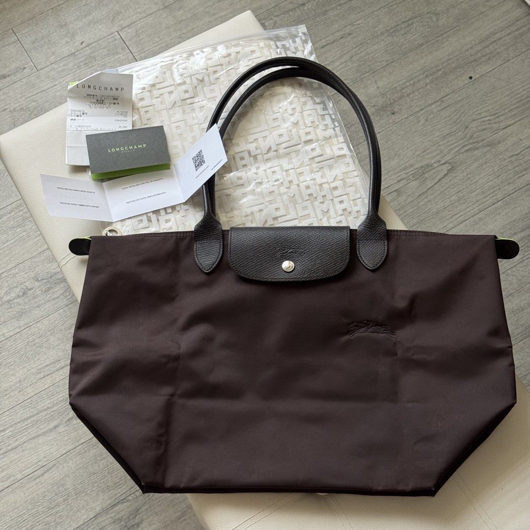 Authentic Longchamp Le Pliage Green Series Mocha Large Long Handle (Category: Shoulder Bags) located in Mandaluyong City. Submitted by theprimeclassics (Listing ID 1470666498, Image 1). Description: Personal preloved for SALE! Longchamp Le Pliage Green Series Mocha Large Long Handle 8.5/10 condition Minimal signs of use With paper bag, receipt, QR care card, zip pouch, free organizer..