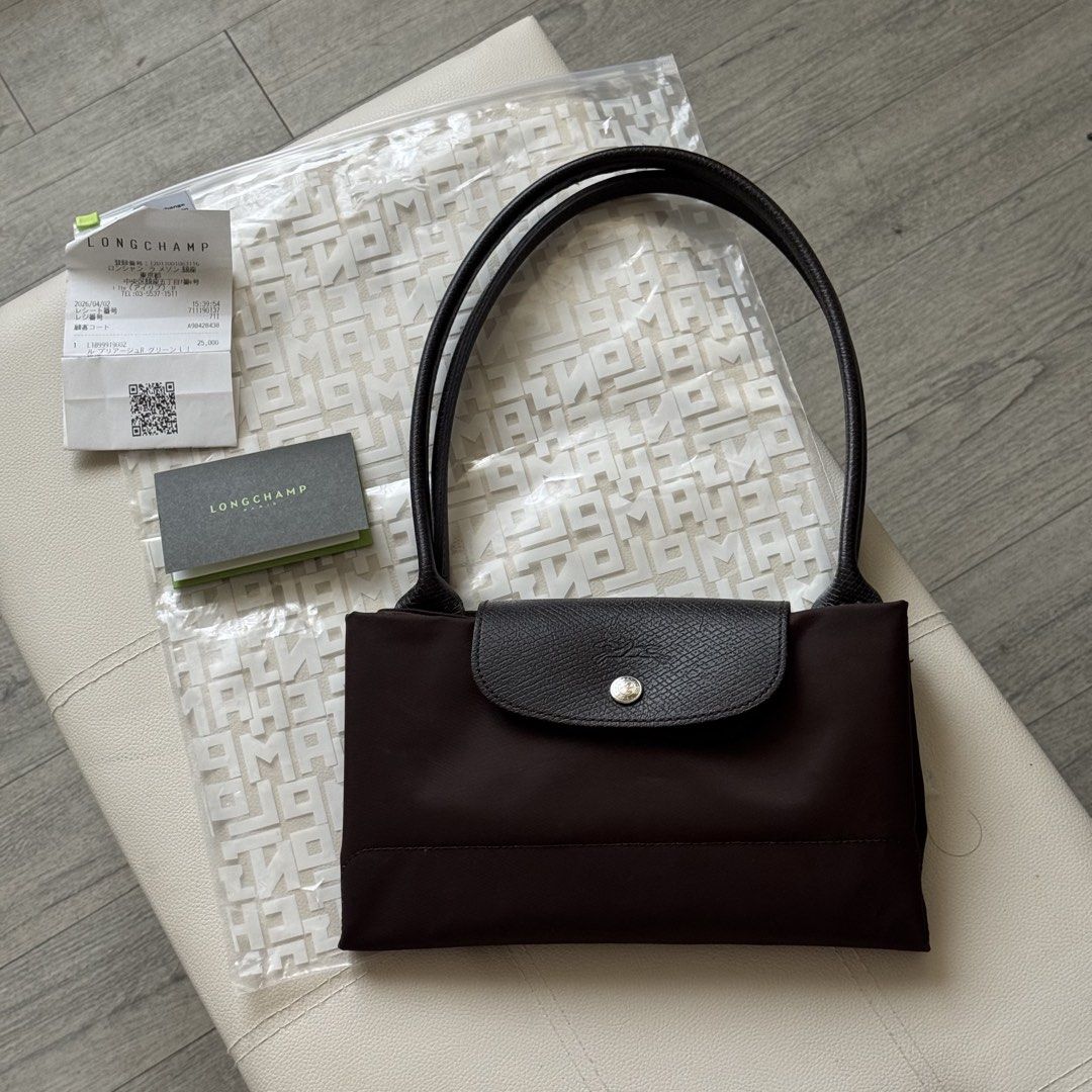 Authentic Longchamp Le Pliage Green Series Mocha Large Long Handle (Category: Shoulder Bags) located in Mandaluyong City. Submitted by theprimeclassics (Listing ID 1470666498, Image 2). Description: Personal preloved for SALE! Longchamp Le Pliage Green Series Mocha Large Long Handle 8.5/10 condition Minimal signs of use With paper bag, receipt, QR care card, zip pouch, free organizer..