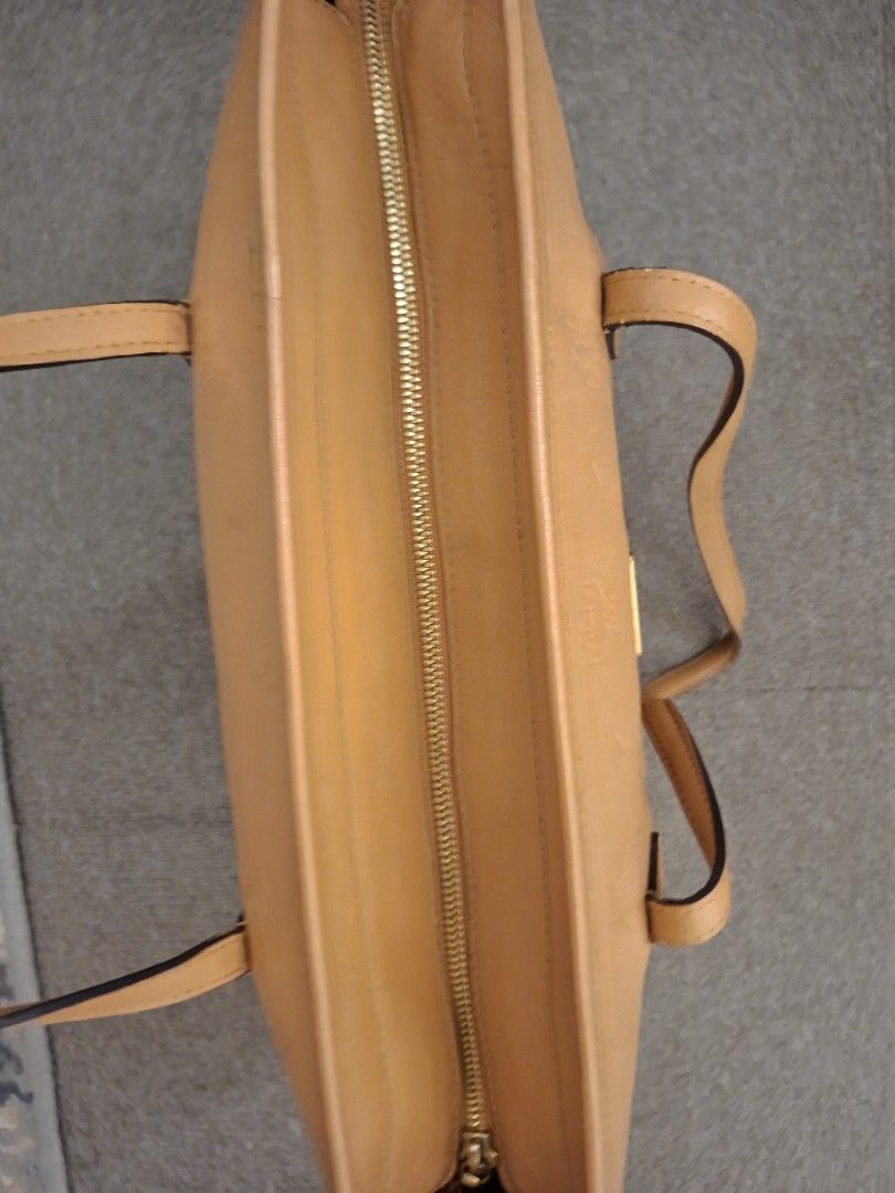 Authentic MCM Cognac Monogram Embossed Leather Tote Bag (Category: Tote Bags) located in Antipolo. Submitted by cheche2111 (Listing ID 1470561813, Image 3). Description: - Material: Premium tan leather with all-over embossed MCM monogram pattern - Hardware: Elegant gold-tone hardware with front metal plaque (stamped Munich and serial number S8727) - Closure: Secure zip-top closure - Straps: Comfortable double shoulder straps in matching tan leath