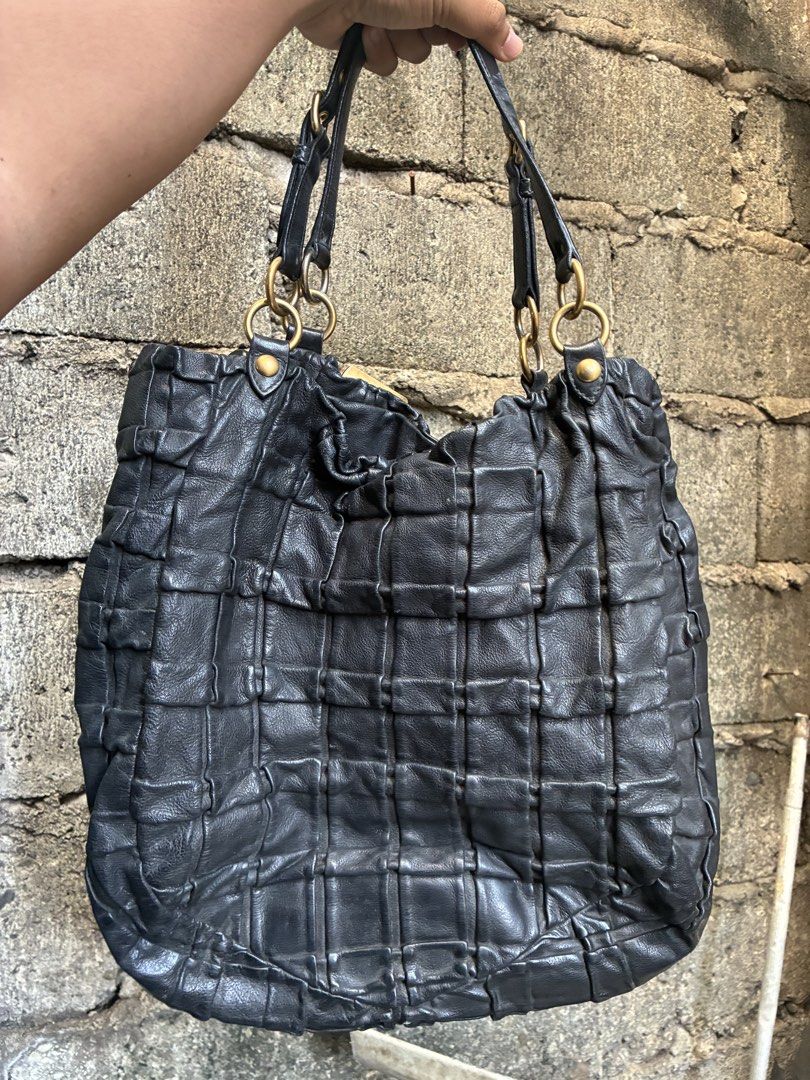 Authentic Miu Miu Black Leather Shoulder Bag (Category: Shoulder Bags) located in Manila. Submitted by assortedgoodsv3 (Listing ID 1470619796, Image 3). Description: - Brand: Miu Miu - Material: Soft black gathered leather with structured vertical panels - Hardware: Premium gold-tone (rings, studs, and zipper pullers) - Straps: Dual comfortable shoulder straps with metal ring attachments - Interior: Black fabric lining with a secure zip pocket an