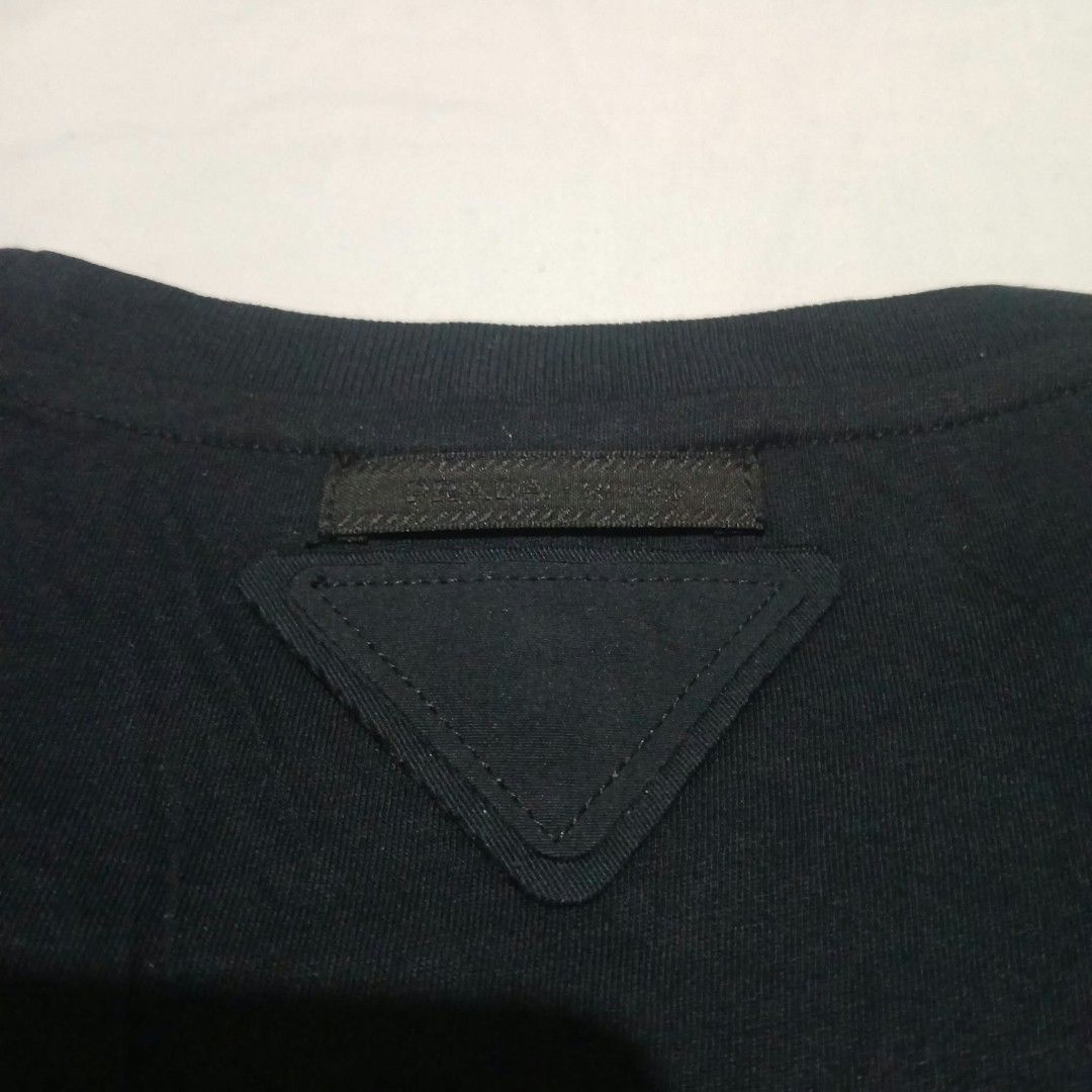 Authentic Prada Floral Applique T-Shirt (Category: Shirts) located in Mangaldan. Submitted by used2.wearwomens (Listing ID 1470675051, Image 3). Description: Good Condition No Issue Size Large On Tag Width 19 Length 22.5 Kindly Check All Posted Pictures.