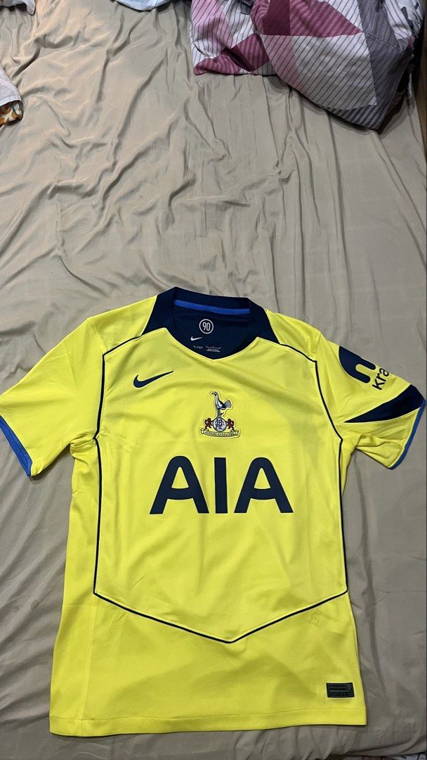 AUTHENTIC Tottenham Hotspur Away Jersey Nike Size M (Category: Activewear) located in Makati City. Submitted by trinitymaehollmann (Listing ID 1470622799, Image 2). Description: - Brand: Nike - Team: Tottenham Hotspur Away - Color: Bright yellow with navy blue collar, piping, and sponsor logo - Details: Embroidered club crest, AIA text, and Nike swoosh - Technology: Dri-FIT material with engineered hem tag - Size: M (fits true) - Origin: Made in 