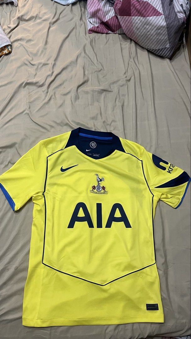 AUTHENTIC Tottenham Hotspur Away Jersey Nike Size M (Category: Activewear) located in Makati City. Submitted by trinitymaehollmann (Listing ID 1470622799, Image 3). Description: - Brand: Nike - Team: Tottenham Hotspur Away - Color: Bright yellow with navy blue collar, piping, and sponsor logo - Details: Embroidered club crest, AIA text, and Nike swoosh - Technology: Dri-FIT material with engineered hem tag - Size: M (fits true) - Origin: Made in 