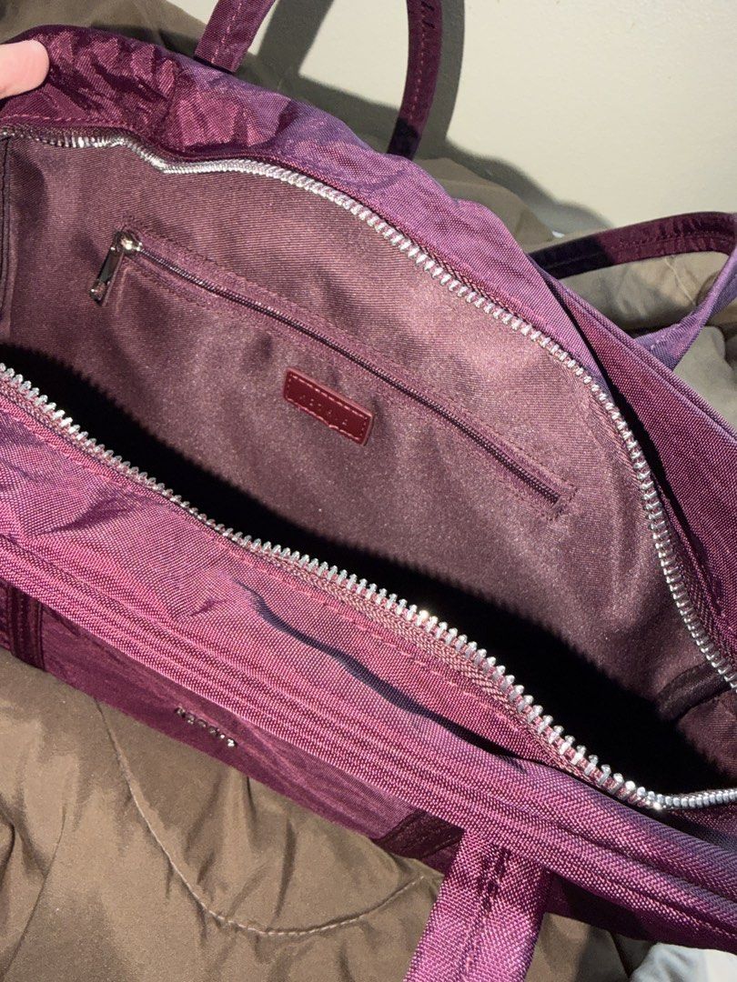 AZTRID Burgundy Boston Air Medium (Category: Tote Bags) located in Los Banos. Submitted by sashimituna (Listing ID 1470680442, Image 2). Description: - Brand: AZTRID - Material: Durable purple nylon with silver-tone hardware - Straps: Comfortable double shoulder straps - Closure: Secure top zipper closure - Interior: Dark fabric lining with a zippered side pocket and leather brand tag - Condition: Clean inside and out, excellent everyday bag - Si
