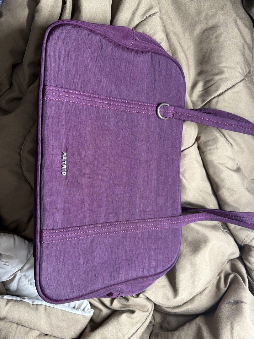 AZTRID Burgundy Boston Air Medium (Category: Tote Bags) located in Los Banos. Submitted by sashimituna (Listing ID 1470680442, Image 1). Description: - Brand: AZTRID - Material: Durable purple nylon with silver-tone hardware - Straps: Comfortable double shoulder straps - Closure: Secure top zipper closure - Interior: Dark fabric lining with a zippered side pocket and leather brand tag - Condition: Clean inside and out, excellent everyday bag - Si