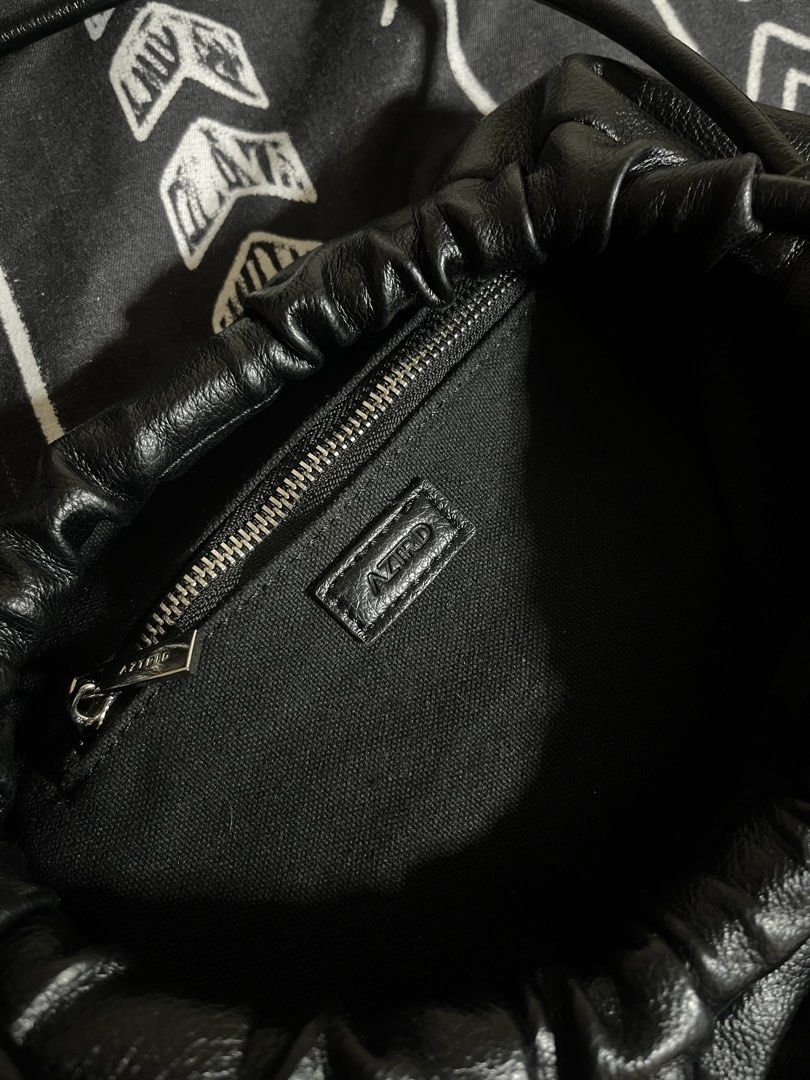 AZTRID Medium Dumpling Bag (Category: Shoulder Bags) located in Manila. Submitted by p1nkbaddi3 (Listing ID 1470655951, Image 3). Description: LAST PRICE POSTED. - Brand: AZTRID - Color: Classic Black - Design: Trendy ruched top opening with dual thin handles - Hardware: Metal brand logo plate near the bottom front - Interior: Fabric-lined with a convenient zip pocket - Packaging: Includes original box and dust bag - Condition: Excellent - Perfec