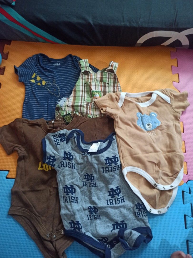Baby Bodysuits and Overalls Bundle Assorted Sizes (Category: Babies & Kids Fashion) located in Manila. Submitted by loloeve12117993 (Listing ID 1470702973, Image 1). Description: - Set of 5 adorable baby clothes essentials - Includes: blue striped t-shirt, green plaid overalls, brown bear onesie, plain brown bodysuit, and grey Notre Dame romper - Features a mix of short sleeves and convenient bottom snap buttons for easy diaper changes - Made fro