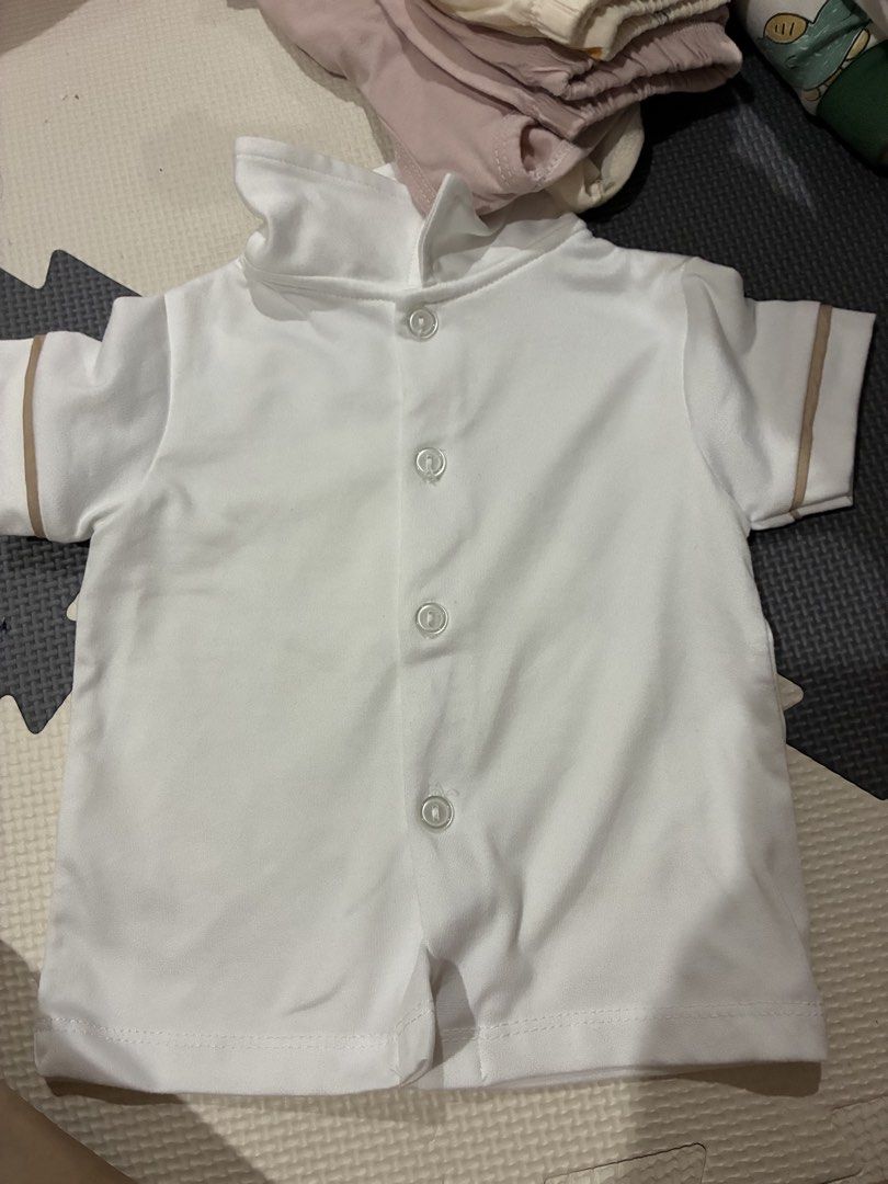 Baby clothing set assorted bodysuits and shorts bundle (Category: Babies & Kids Fashion) located in Makati City. Submitted by chenfrng (Listing ID 1470665691, Image 3). Description: There are many stocks to choose from. - Adorable baby clothes bundle for everyday wear and lounging - Includes Doraemon tank top, blue star bodysuit, white button-up shirt, dog pattern bodysuit, and pink safari sets - Assorted colors: white, blue, pink, and dark blue 
