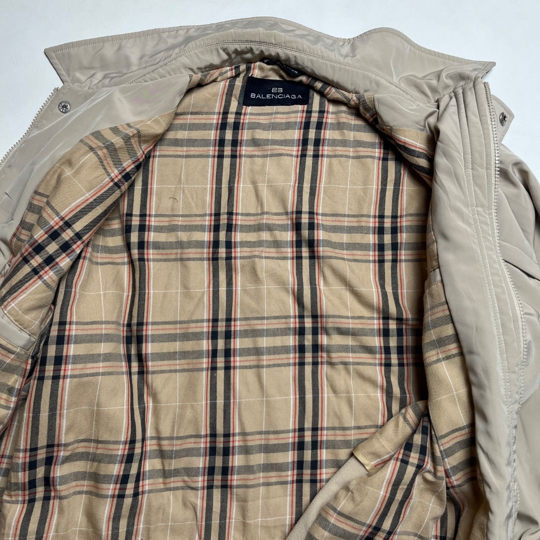 Balenciaga Beige Plaid Lined Button Jacket Size 4 (Category: Coats, Jackets and Outerwear) located in Caloocan City. Submitted by achilles_grails (Listing ID 1470584284, Image 3). Description: - Brand: Balenciaga - Color: Neutral beige with classic plaid inner lining - Size: 4 - Material: Polyester and polyurethane shell - Closure: Snap button front closure - Pockets: Two large lower flap pockets and one zippered chest pocket - Details: Embroider