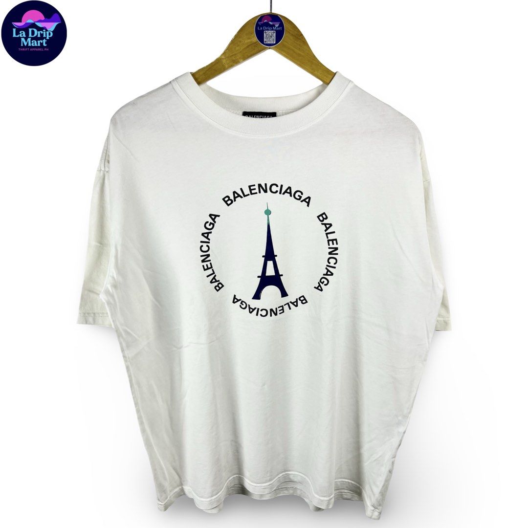 ‎“BALENCIAGA PARIS” ‎EIFFEL TOWER GRPHC TEE (Category: Tshirts & Polo Shirts ) located in Taguig. Submitted by ldm.ph (Listing ID 1470742510, Image 1). Description: ‎(LDM-C-0278) ‎Size:ACTUAL FIT:LARGE ‎Dimensions ‎Inches width:23 ‎Inches length:27 ‎Condition: EXCELLENT ‎Color rate:9.5 ‎Flaws:❌ ‎(READY TO WEAR).