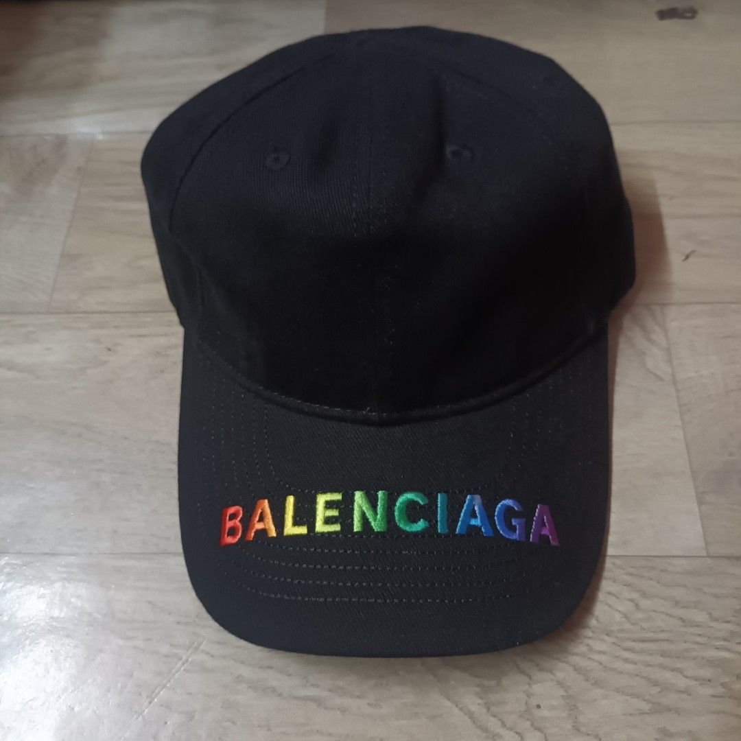 Balenciaga Pride Rainbow Logo Black Cap (Category: Caps & Hats) located in Manila. Submitted by itsnik444 (Listing ID 1470648941, Image 1). Description: - Brand: Balenciaga - Color: Classic black with rainbow embroidered logo on the brim - Fit: Adjustable strap at the back for a customized fit - Details: Authentic interior tag with Balenciaga Paris branding and fabric composition - Condition: Clean, flawless, and shows no signs of wear.