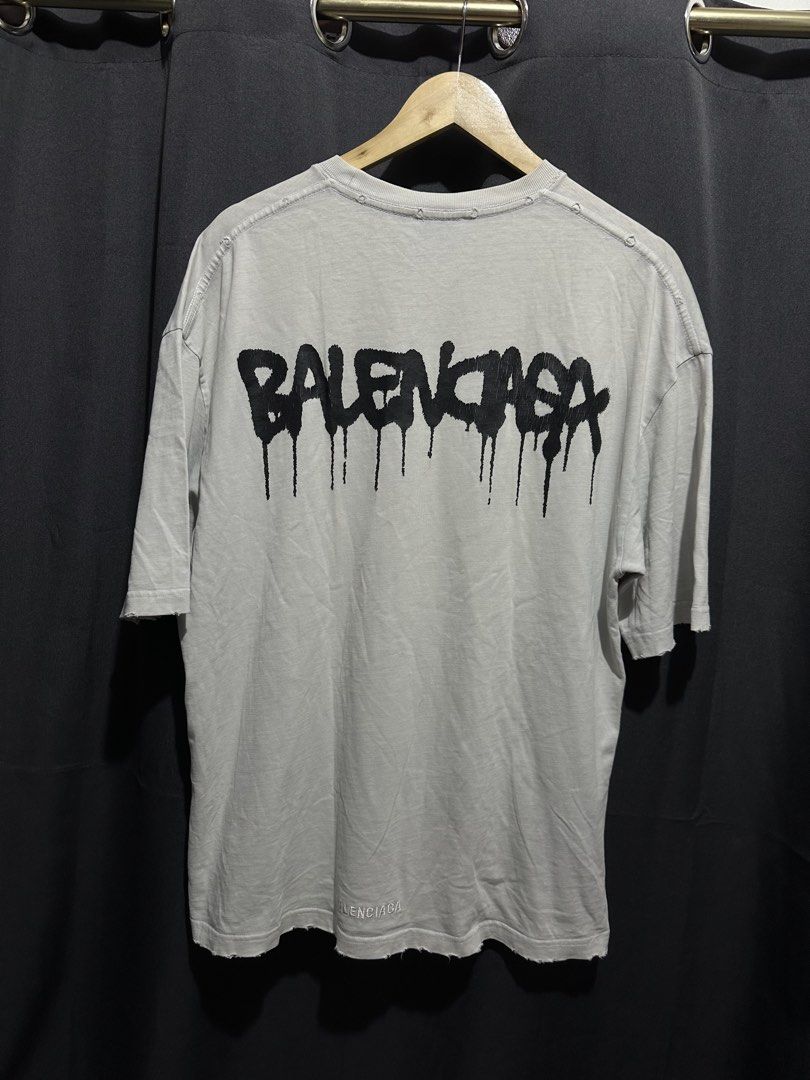 Balenciaga Unifit Drip Logo Distressed Tee (Category: Tshirts & Polo Shirts ) located in Buenavista. Submitted by themodernrack (Listing ID 1470591072, Image 2). Description: Condition: Good condition, minimal hairlines, needs wash on some parts (features intentional factory distressing/riips throughout collar and cuffs as part of the Unifit design) Measurements & Sizing: Size: Tagged Size XS (Oversized boxy fit, fits up to M/L) Width (Pit to Pit