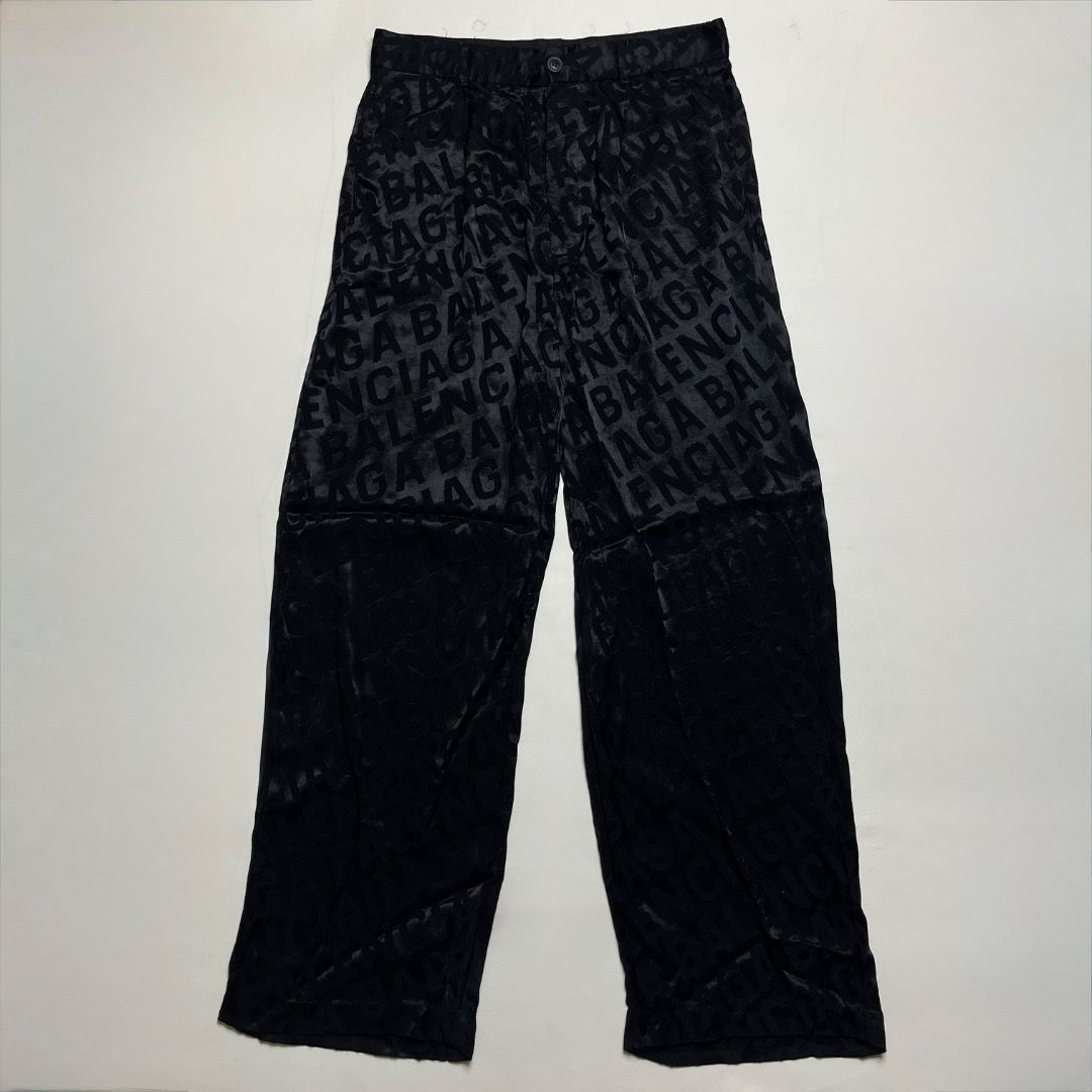 Balenciaga Wardrobe Unisex Monogram Pants (Category: Luxury Apparel) located in Caloocan City. Submitted by achilles_grails (Listing ID 1470603275, Image 1). Description: - Brand: Balenciaga Wardrobe (Unisex) - Design: All-over black monogram pattern with subtle tonal text - Fit: Straight, relaxed leg fit - Details: Button closure at the waist with branded hardware - Interior: Signature Balenciaga Wardrobe label stitched inside - Condition: Brand