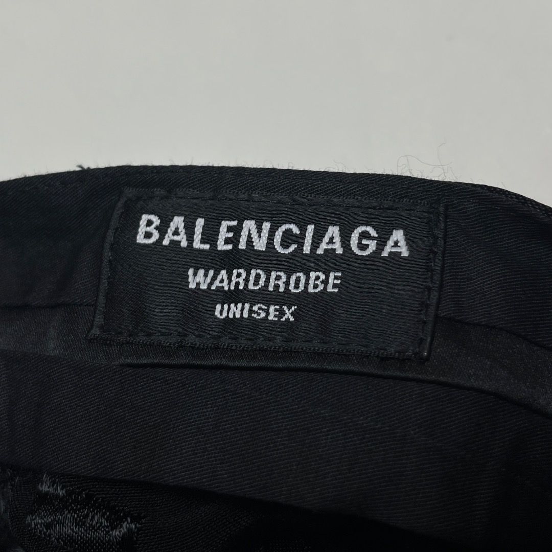 Balenciaga Wardrobe Unisex Monogram Pants (Category: Luxury Apparel) located in Caloocan City. Submitted by achilles_grails (Listing ID 1470603275, Image 3). Description: - Brand: Balenciaga Wardrobe (Unisex) - Design: All-over black monogram pattern with subtle tonal text - Fit: Straight, relaxed leg fit - Details: Button closure at the waist with branded hardware - Interior: Signature Balenciaga Wardrobe label stitched inside - Condition: Brand