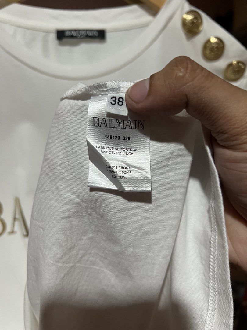Balmain Gold button shirt (Category: Tshirts & Polo Shirts ) located in Sibulan. Submitted by rustysbestpick (Listing ID 1470665407, Image 3). Description: Balmain Gold button shirt Authentic Excellent condition Issue: ripped fabric on 1 gold button Washed & ready to wear Size 38 (fits small/medium) .