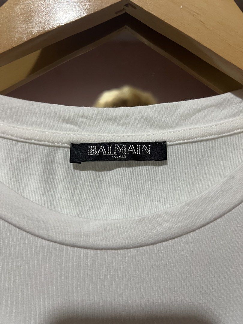 Balmain Gold button shirt (Category: Tshirts & Polo Shirts ) located in Sibulan. Submitted by rustysbestpick (Listing ID 1470665407, Image 2). Description: Balmain Gold button shirt Authentic Excellent condition Issue: ripped fabric on 1 gold button Washed & ready to wear Size 38 (fits small/medium) .