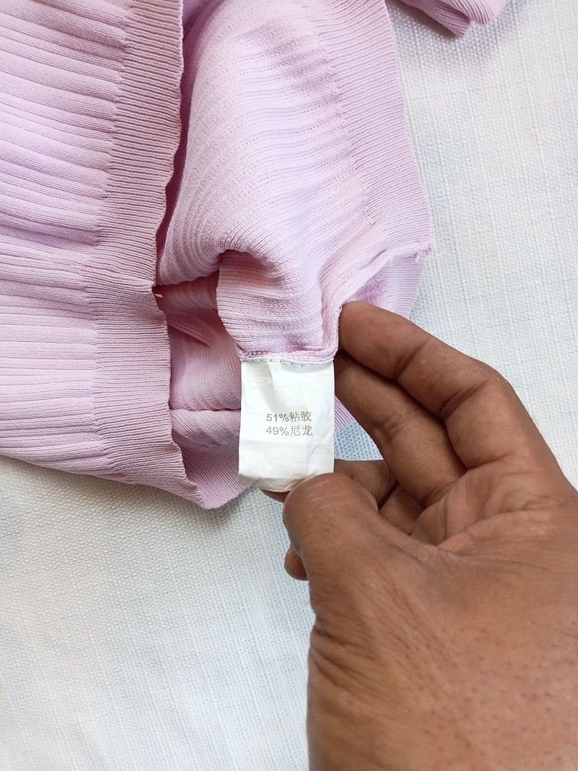 Balmain pink v neck knitted top (Category: Shirts) located in Bagabag. Submitted by thrift_stories96 (Listing ID 1470700473, Image 3). Description: Balmain pink v neck knitted top Small Length - 18 Width - 14 stretch up to 17 Condition - excellent No flaw.
