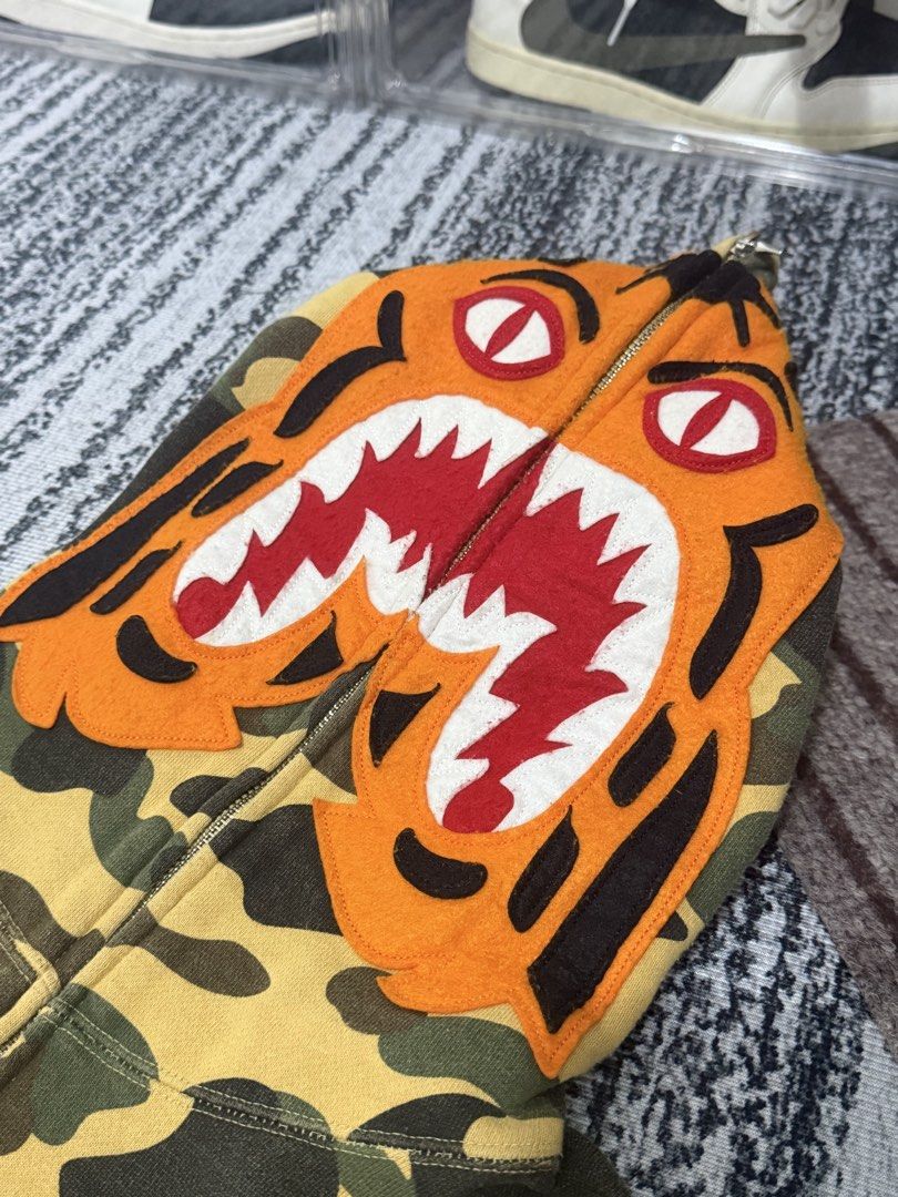 BAPE 1st Camo Yellow Tiger Full Zip (Category: Coats, Jackets and Outerwear) located in Dinalupihan. Submitted by arvi.findings. (Listing ID 1470658426, Image 1). Description: Bape 1st Yellow Camo Tiger Full Zip Size: Medium Width: 20.5 - 21 inches Length: 26.5 - 27 inches Colorate: 8.8 or better Issue: Minimal Hairlines, Minimal Cracks Minimal Lints, and Stain on Cuff. See pictures. 5,500 nego + Shipping .