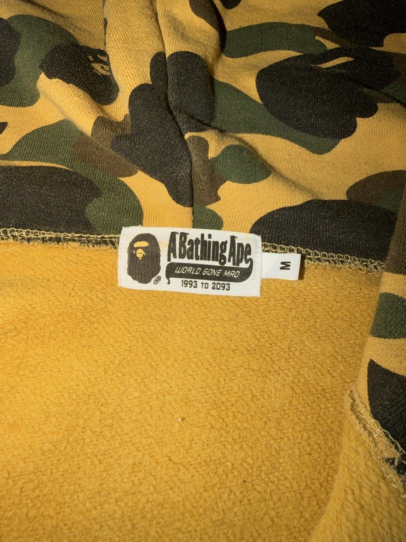 BAPE 1st Camo Yellow Tiger Full Zip (Category: Coats, Jackets and Outerwear) located in Dinalupihan. Submitted by arvi.findings. (Listing ID 1470658426, Image 3). Description: Bape 1st Yellow Camo Tiger Full Zip Size: Medium Width: 20.5 - 21 inches Length: 26.5 - 27 inches Colorate: 8.8 or better Issue: Minimal Hairlines, Minimal Cracks Minimal Lints, and Stain on Cuff. See pictures. 5,500 nego + Shipping .