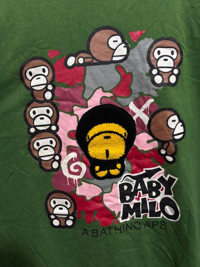 Bape Baby Milo Shirt (Category: Tshirts & Polo Shirts ) located in Bauan. Submitted by onetwothrift2 (Listing ID 1470652826, Image 3). Description: Bape Baby Milo Shirt Size: Large Dimes: L27 W20.5 Color rate: 9/10 Good condition No Issue Mine: 450.
