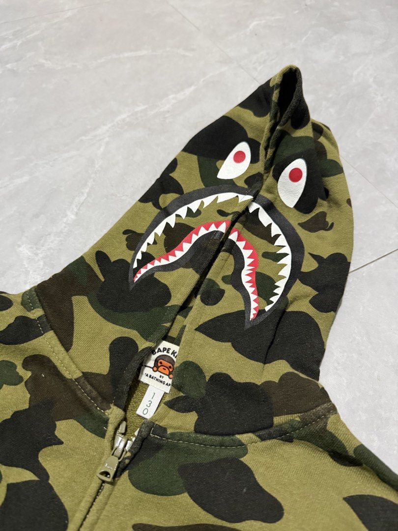 Bape Kids Camo Zip (Category: Hoodies) located in Calumpit. Submitted by Essentiality (Listing ID 1470622758, Image 3). Description: Bape Kids Camo Zip 17x20 M on tag ₱1,500.