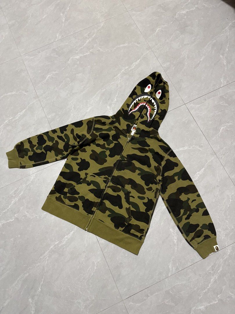 Bape Kids Camo Zip (Category: Hoodies) located in Calumpit. Submitted by Essentiality (Listing ID 1470622758, Image 1). Description: Bape Kids Camo Zip 17x20 M on tag ₱1,500.