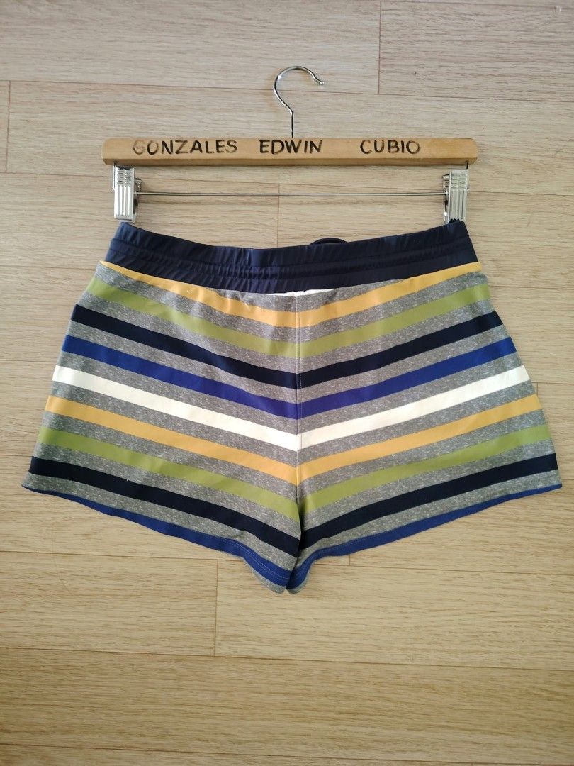 Basic Elle Striped Drawstring Athletic Shorts Size XL (Category: Shorts) located in Nasipit. Submitted by edwingonzales498-69377 (Listing ID 1470615696, Image 3). Description: - Brand: Basic Elle - Size: XL (Waist: 28-34 inches, Length: 10 inches) - Material: 80% polyester, 20% polyurethane - Design: Multi-colored horizontal stripes (navy blue, green, yellow, grey, white) - Features: Elastic waistband with adjustable drawstring, two front hand po