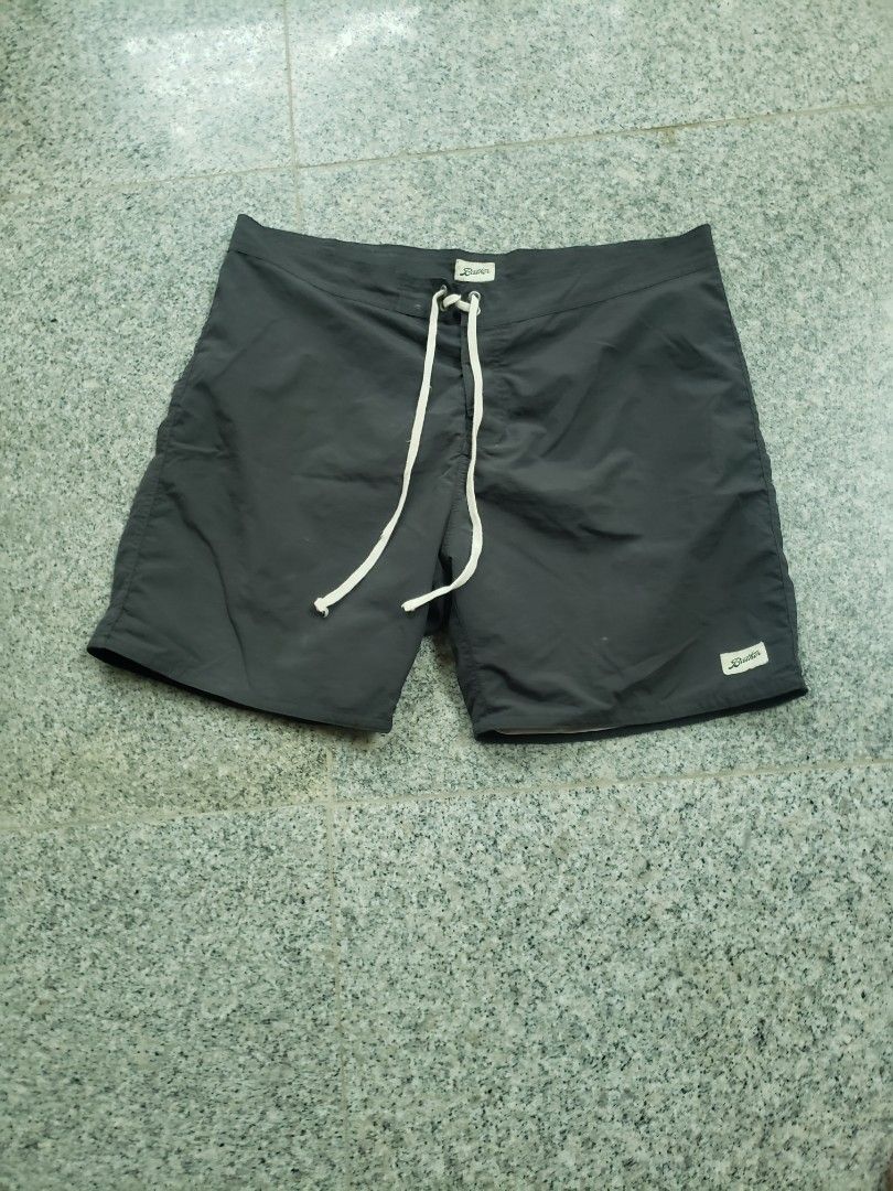 Bather Dark Grey Swim Trunks Size 34 (Category: Swim Trunks & Board Shorts) located in Pagsanghan. Submitted by yuchinz (Listing ID 1470660596, Image 1). Description: - Brand: Bather - Color: Solid dark grey - Size: 34 waist with adjustable drawstring closure - Material: 100% polyester shell, 100% nylon lining - Origin: Made in Canada - Details: Small woven Bather branding patch near the hem - Care: Machine wash cold, hang to dry.