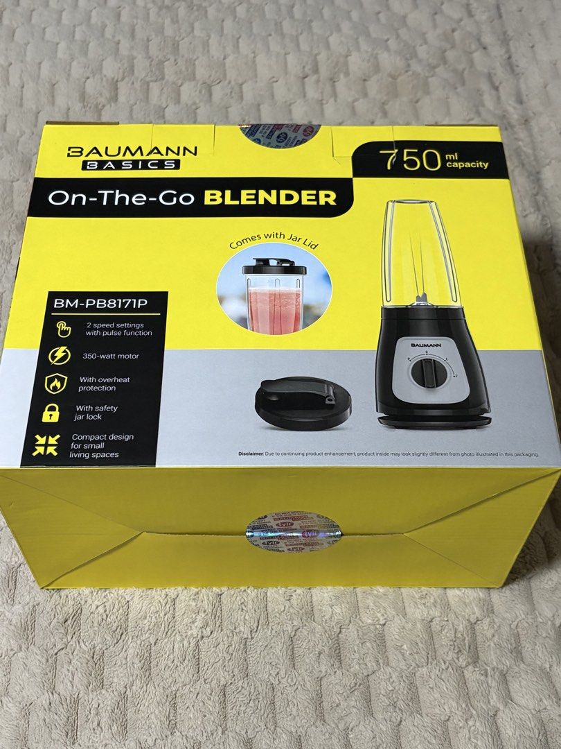 Baumann Basics On-The-Go Blender BM-PB817P (Category: Juicers, Blenders & Grinders) located in Bulacan. Submitted by printexpression (Listing ID 1470683944, Image 2). Description: - Model: Baumann Basics On-The-Go Blender (BM-PB817P) - Condition: Comes with original yellow box packaging - Capacity: 750ml BPA-free blending jar with convenient travel lid - Power: 350-watt motor with 2 speed settings and pulse function - Blades: Durable stainless st