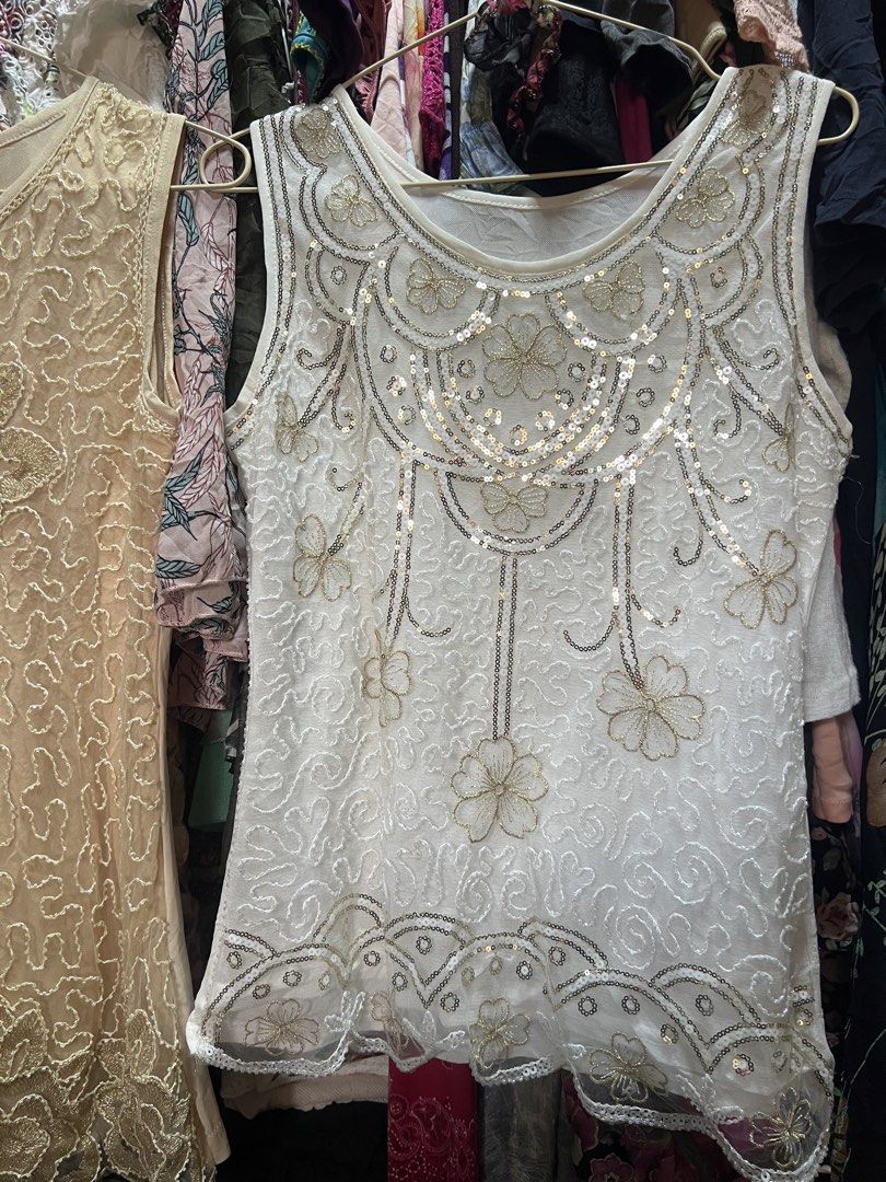 Beaded Sleeveless Top Set Beige and White (Category: Sleeveless) located in Manila. Submitted by threadly (Listing ID 1470611936, Image 3). Description: - 299 EACH. ₱500 BOTH Set of 2 sleeveless sheer mesh tops (Beige and White) - Beautiful beadwork, sequins, and embroidered floral details - Classic round neckline and lightweight construction - Versatile pieces great for layering or evening wear - Selling as a bundle.