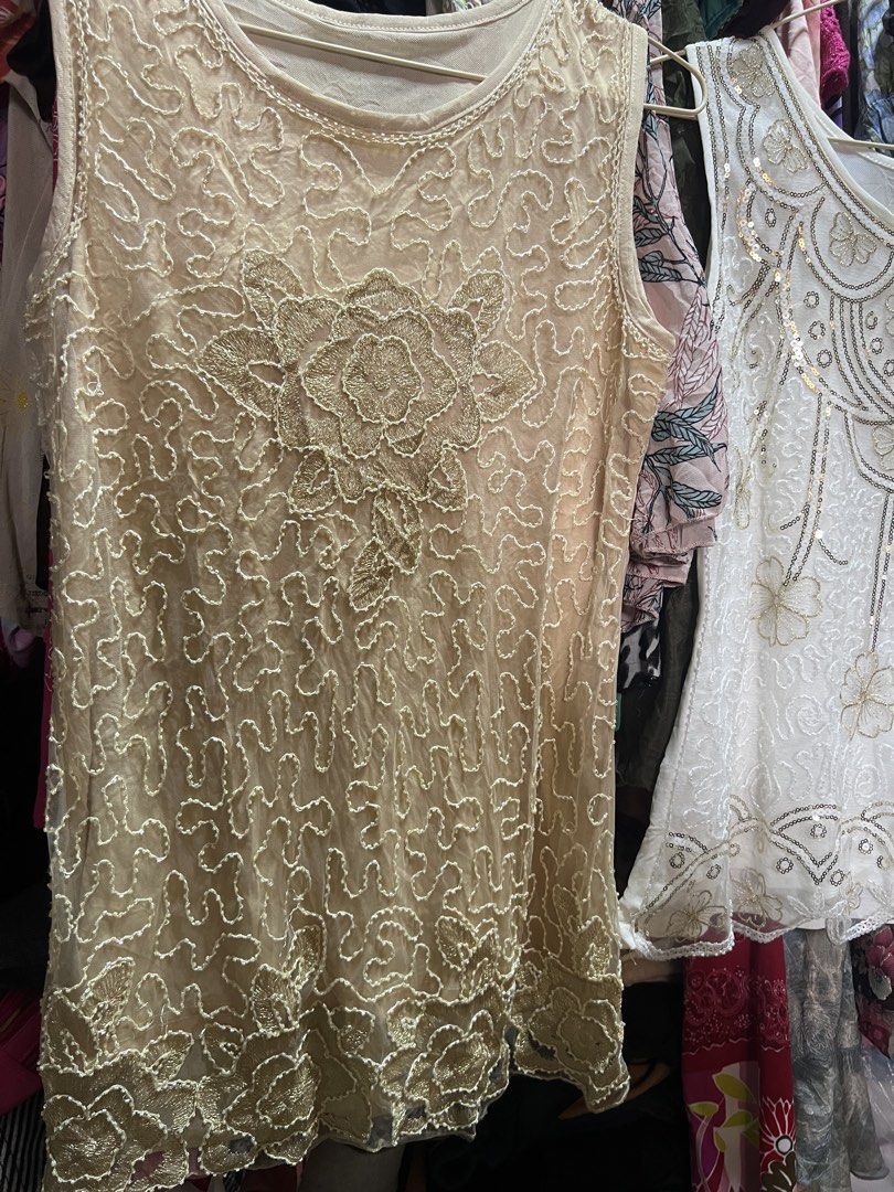 Beaded Sleeveless Top Set Beige and White (Category: Sleeveless) located in Manila. Submitted by threadly (Listing ID 1470611936, Image 2). Description: - 299 EACH. ₱500 BOTH Set of 2 sleeveless sheer mesh tops (Beige and White) - Beautiful beadwork, sequins, and embroidered floral details - Classic round neckline and lightweight construction - Versatile pieces great for layering or evening wear - Selling as a bundle.